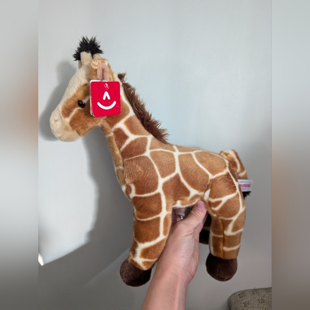 Aurora plush Giraffe with tags.